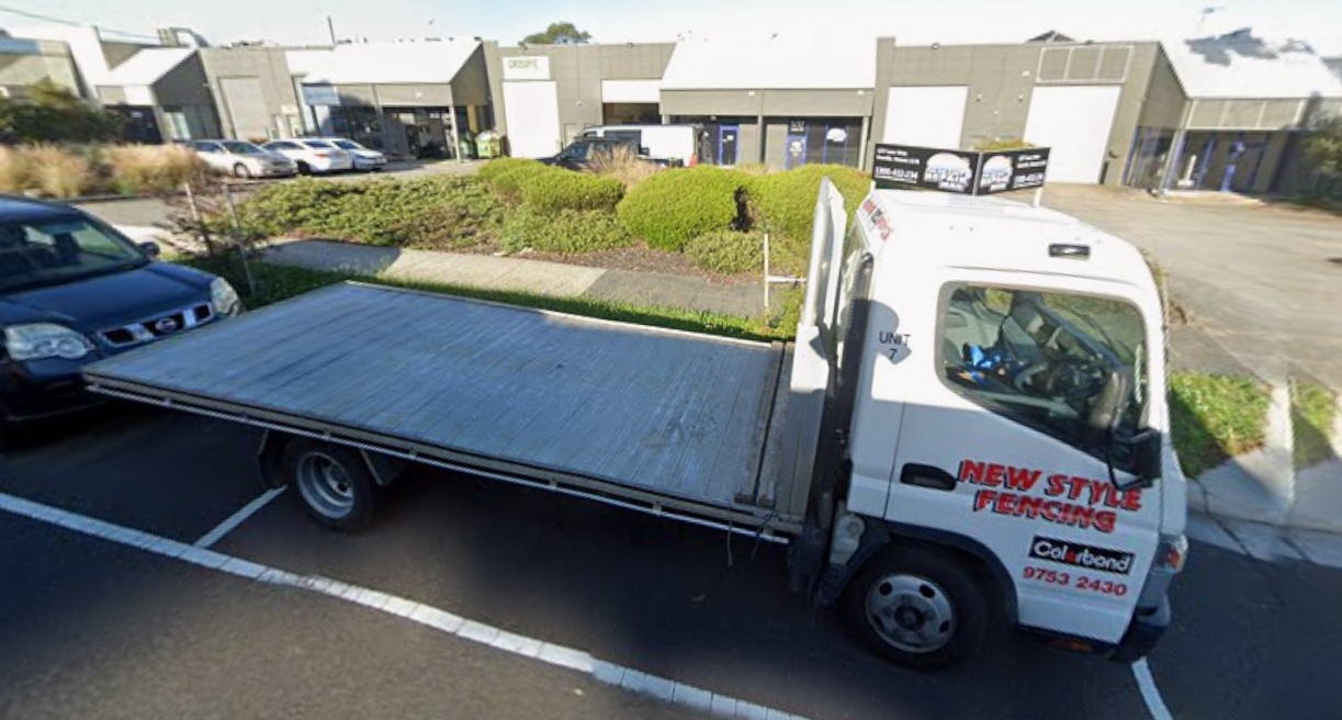 Fencing supply truck delivering materials to Melbourne job site